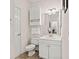 Bright bathroom offering updated fixtures, neutral paint and cabinets, and a tile floor at 4701 Wild Iris Dr. # 16-204, Myrtle Beach, SC 29577