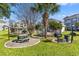 Outdoor community area with picnic seating, barbecue, and manicured green spaces at 4701 Wild Iris Dr. # 16-204, Myrtle Beach, SC 29577