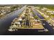 Gorgeous aerial view of homes lining a waterway, with boat docks and lush greenery at 4843 Williams Island Dr., Little River, SC 29566