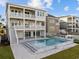 Spectacular elevated home featuring a swimming pool, multiple decks, and landscaped backyard at 4843 Williams Island Dr., Little River, SC 29566