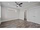 Spacious bedroom with a ceiling fan and en-suite bathroom at 4843 Williams Island Dr., Little River, SC 29566
