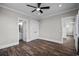 Bright bedroom with a ceiling fan and an ensuite bathroom at 4843 Williams Island Dr., Little River, SC 29566