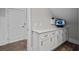 Bonus room features built in cabinets and modern lighting at 4843 Williams Island Dr., Little River, SC 29566