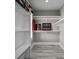 Organized walk-in closet with shelving and hanging rods at 4843 Williams Island Dr., Little River, SC 29566