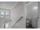 Bright hallway leading to a bathroom with shiplap walls and a modern vanity at 4843 Williams Island Dr., Little River, SC 29566