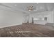 Spacious living room with tray ceilings, recessed lighting, and a seamless open floor plan at 4843 Williams Island Dr., Little River, SC 29566