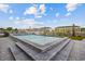 A picturesque pool surrounded by pavers and lush landscaping at 4843 Williams Island Dr., Little River, SC 29566