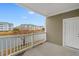 Balcony overlooking a pond with waterfront condos under a clear blue sky at 4875 Luster Leaf Circle # 202, Myrtle Beach, SC 29577