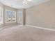 Bright bedroom features large windows, neutral paint, and carpeted floors at 4875 Luster Leaf Circle # 202, Myrtle Beach, SC 29577