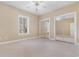 Bedroom with natural light, ceiling fan, and closet with mirrored doors at 4875 Luster Leaf Circle # 202, Myrtle Beach, SC 29577