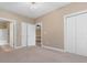 Spacious bedroom with carpeted floor, ensuite bathroom, and access to closet at 4875 Luster Leaf Circle # 202, Myrtle Beach, SC 29577