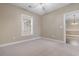 Bright bedroom with neutral walls, ceiling fan, carpeted floor, and window at 4875 Luster Leaf Circle # 202, Myrtle Beach, SC 29577