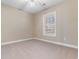 This bedroom features neutral walls, a ceiling fan, carpeted floors and a window at 4875 Luster Leaf Circle # 202, Myrtle Beach, SC 29577