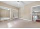Bedroom with sliding mirror closet doors and door to balcony at 4875 Luster Leaf Circle # 202, Myrtle Beach, SC 29577