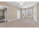 Spacious bedroom with natural light, closet, and neutral carpet at 4875 Luster Leaf Circle # 202, Myrtle Beach, SC 29577