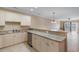 Open kitchen design featuring sleek countertops and modern appliances at 4875 Luster Leaf Circle # 202, Myrtle Beach, SC 29577