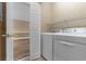 Laundry room featuring modern washer and dryer set with shelving for storage at 4875 Luster Leaf Circle # 202, Myrtle Beach, SC 29577