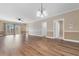 Open living space with sliding door access to a balcony, hardwood floors, and neutral paint at 4875 Luster Leaf Circle # 202, Myrtle Beach, SC 29577