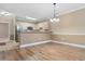 Well-lit living space complemented by hardwood floors and modern lighting at 4875 Luster Leaf Circle # 202, Myrtle Beach, SC 29577