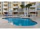 Community pool with surrounding lounge chairs, poolside seating, and condo views at 4875 Luster Leaf Circle # 202, Myrtle Beach, SC 29577