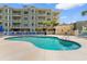 Community pool with poolside seating and sun loungers for relaxation at 4875 Luster Leaf Circle # 202, Myrtle Beach, SC 29577