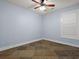 Clean and bright bedroom showcasing tile floors, a ceiling fan, and natural light from a window at 489 Harbour View Dr., Myrtle Beach, SC 29579