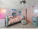 Whimsical bedroom with lilac walls, comfortable daybed, and eclectic decor at 489 Harbour View Dr., Myrtle Beach, SC 29579