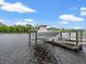 Waterfront home featuring a private boat lift with boat, dock, and scenic water views at 489 Harbour View Dr., Myrtle Beach, SC 29579