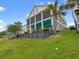 Beautiful two-story home with a screened porch and lush landscaping on a well-maintained lawn at 489 Harbour View Dr., Myrtle Beach, SC 29579