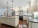 Gourmet kitchen with granite countertops, stainless steel appliances, and dark wood flooring at 489 Harbour View Dr., Myrtle Beach, SC 29579