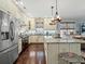 Bright kitchen with stainless appliances, a center island, and plenty of counter space at 489 Harbour View Dr., Myrtle Beach, SC 29579