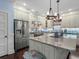 Spacious kitchen featuring a large island, stainless steel appliances, and custom cabinetry at 489 Harbour View Dr., Myrtle Beach, SC 29579