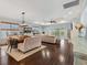 Spacious living area with hardwood floors, tray ceilings, and access to an outdoor space at 489 Harbour View Dr., Myrtle Beach, SC 29579