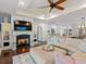 Spacious living room featuring a fireplace, tray ceiling, and comfortable seating arrangement at 489 Harbour View Dr., Myrtle Beach, SC 29579