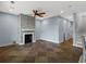 Bright, open living room featuring a stone fireplace and seamless flooring at 489 Harbour View Dr., Myrtle Beach, SC 29579
