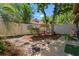 Serene backyard with mature trees and seating area is perfect for outdoor relaxation and entertaining at 490 Ocean Creek Dr. # 8, Myrtle Beach, SC 29572