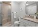 Tastefully renovated bathroom with granite counters and walk-in shower with glass doors at 490 Ocean Creek Dr. # 8, Myrtle Beach, SC 29572