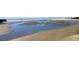 Expansive beach view with ocean inlets and scenic walkways at 490 Ocean Creek Dr. # 8, Myrtle Beach, SC 29572