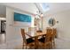 Dining area with wood table offers a welcoming space for meals with a view into the kitchen at 490 Ocean Creek Dr. # 8, Myrtle Beach, SC 29572