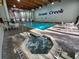Inviting indoor pool and hot tub area with bright lighting and comfortable seating at 490 Ocean Creek Dr. # 8, Myrtle Beach, SC 29572