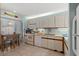 Bright kitchen features white cabinets, and a breakfast nook for casual dining at 490 Ocean Creek Dr. # 8, Myrtle Beach, SC 29572