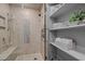 Close up of walk-in shower and built-in shelves for storage at 490 Ocean Creek Dr. # 8, Myrtle Beach, SC 29572