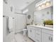 Bright bathroom features a vanity with white cabinetry, a tub and shower combo, and beachy decor at 500 Canborough Lane, Murrells Inlet, SC 29576