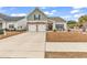 Charming home featuring a two-car garage, well-manicured lawn, and inviting curb appeal at 500 Canborough Lane, Murrells Inlet, SC 29576