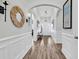 Bright entryway featuring wood floors, archways, decorative lighting, and detailed trim work at 500 Canborough Lane, Murrells Inlet, SC 29576