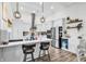 Bright and modern kitchen boasts a large island, stainless appliances, and sleek countertops for culinary delights at 500 Canborough Lane, Murrells Inlet, SC 29576