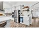 Modern kitchen with stainless steel appliances, wine fridge, stylish décor, and ample storage, a perfect entertaining space at 500 Canborough Lane, Murrells Inlet, SC 29576