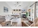 Bright living room with a fireplace, comfortable seating, and neutral decor at 500 Canborough Lane, Murrells Inlet, SC 29576