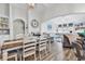 Inviting living area with wood floors flows from dining room; offering open and airy space with ample natural light at 500 Canborough Lane, Murrells Inlet, SC 29576