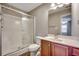 Bright bathroom featuring a stand-up shower with glass doors and vanity with cabinets at 504 Lake Shore Dr., Surfside Beach, SC 29575